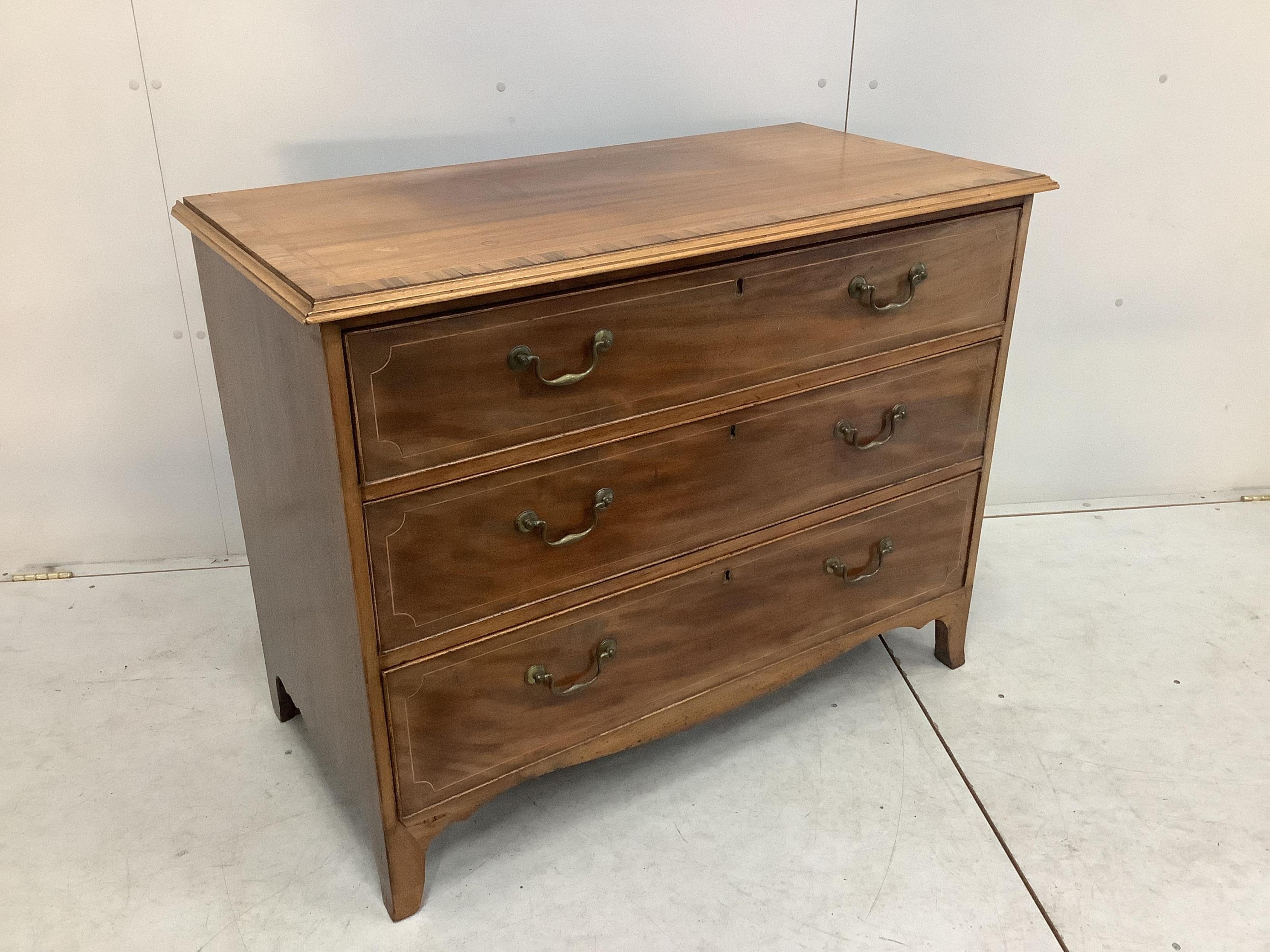 A George III rosewood banded mahogany three drawer chest, width 108cm, depth 55cm, height 84cm. Condition - fair